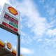 The price of gas is displayed on a sign at a Shell gas station in Washington, DC, on April 12, 2022. - Americans paid more for gasoline, food and other essentials last month amid an ongoing wave of record inflation made worse by Russia’s invasion of Ukraine, according to government data released Tuesday.